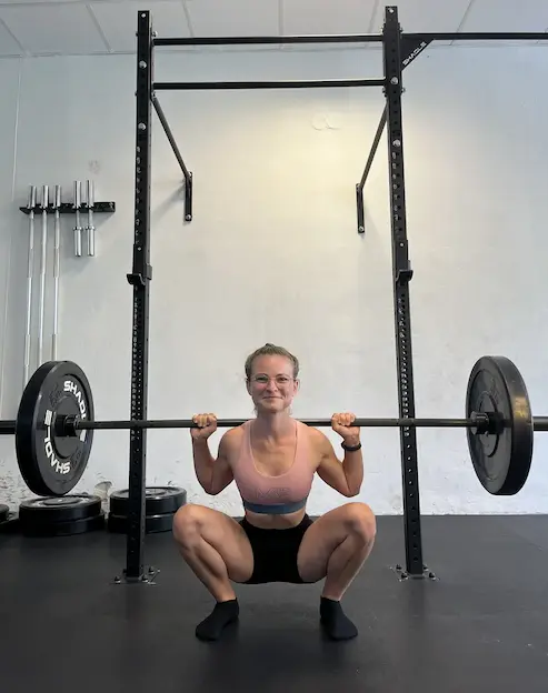 Person performing a squat exercise